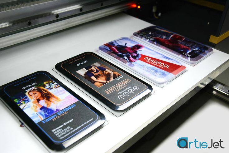 Personalised artwork displayed on wireless charger surfaces.
